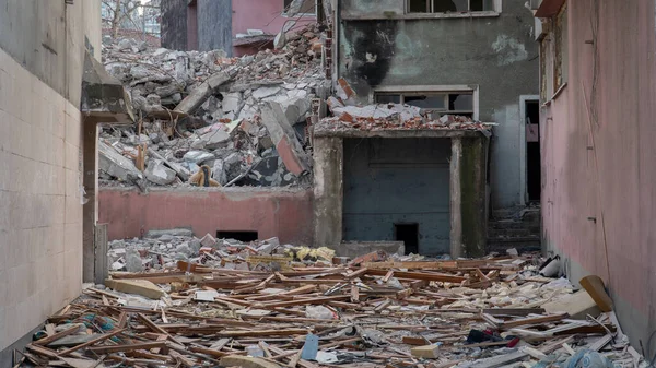 stock image Earthquake damage in a city. Destroyed buildings after an earthquake. Collapsed buildings. Ruined city because of war. Airstrike damages a city. Urban transformation concept. Selective focus included