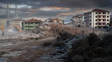 Urban transformation, the process of redevelopment and revitalization of urban areas. Excavators in construction site demolishing old buildings in Golcuk Kocaeli Turkey. Selective focus included