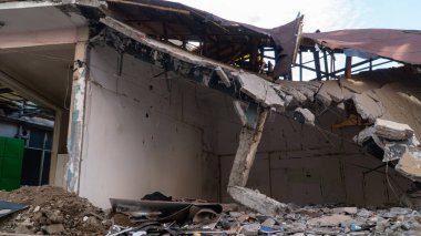 Russia against Ukraine war. in the Middle East. Buildings damaged by an enemy aircraft missiles. Ruined city. Attack on civilian settlements. War crime. Selective focus included