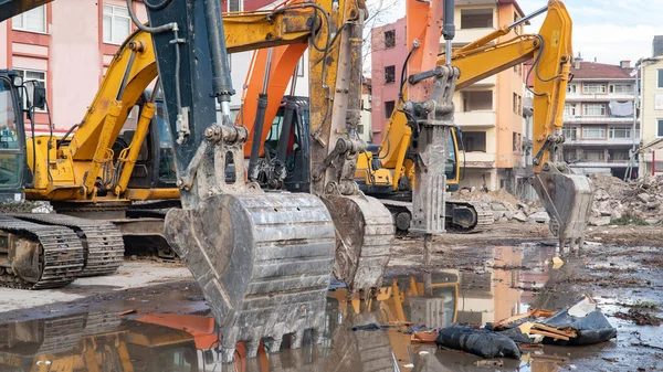 Construction machinery in construction site. Excavator and other heavy machineries
