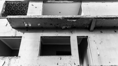 Urban transformation, the process of redevelopment and revitalization of urban areas. Excavators in construction site demolishing old buildings in. Selective focus included