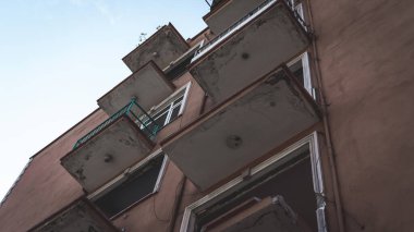 Urban transformation, the process of redevelopment and revitalization of urban areas. Excavators in construction site demolishing old buildings in. Selective focus included
