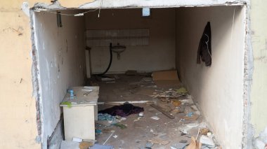 Urban transformation, the process of redevelopment and revitalization of urban areas. Excavators in construction site demolishing old buildings in. Selective focus included