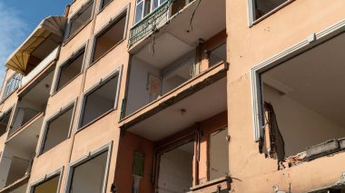 Urban transformation, the process of redevelopment and revitalization of urban areas. Excavators in construction site demolishing old buildings in. Selective focus included
