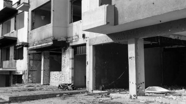 Urban transformation, the process of redevelopment and revitalization of urban areas. Excavators in construction site demolishing old buildings in. Selective focus included