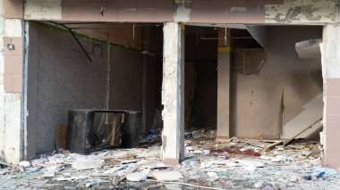 Urban transformation, the process of redevelopment and revitalization of urban areas. Excavators in construction site demolishing old buildings in. Selective focus included