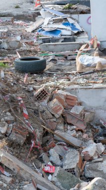 Urban transformation, the process of redevelopment and revitalization of urban areas. Excavators in construction site demolishing old buildings in. Selective focus included
