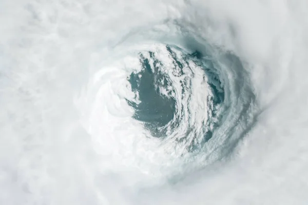 Hurricane from space, satellite view. Hurricane catastrophe. Elements of this image furnished by NASA. Selective focus. Noise and grain included