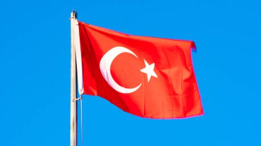 Turkish flag. Turkish flag and dramatic sunset sky. Turkish National holidays concept. 23 Nisan, 19 Mayis, 15 Temmuz, 30 Agustos, 29 Ekim concept. Selective focus. Motion blur due to wind