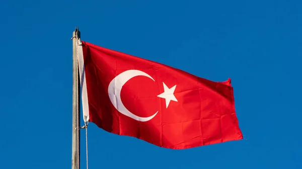 stock image Turkish flag. Turkish flag and dramatic sunset sky. Turkish National holidays concept. 23 Nisan, 19 Mayis, 15 Temmuz, 30 Agustos, 29 Ekim concept. Selective focus. Motion blur due to wind