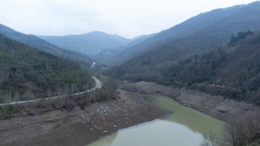 Drought in Turkey. Drought crisis in Turkey. Aerial view of dam with low water level. Yuvacik dam or Kirazdere dam in Kocaeli Turkey. Drone view. Selective focus included. Noisy photo.