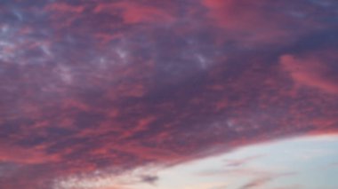 Sunset sky. Cirrocumulus and cirrostratus clouds during sunset. Beautiful dramatic sunset sky background. Blurry background