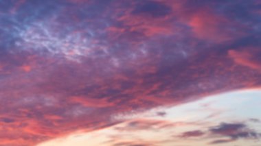 Sunset sky. Cirrocumulus and cirrostratus clouds during sunset. Beautiful dramatic sunset sky background. Blurry background