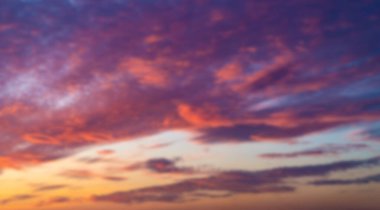 Sunset sky. Cirrocumulus and cirrostratus clouds during sunset. Beautiful dramatic sunset sky background. Blurry background