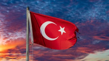 Turkish flag. Turkish flag and dramatic sunset sky. Turkish National holidays concept. 23 Nisan, 19 Mayis, 15 Temmuz, 30 Agustos, 29 Ekim concept. Selective focus. Motion blur due to wind