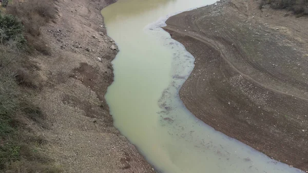 Drought in Turkey. Drought crisis in Turkey. Aerial view of dam with low water level. Yuvacik dam or Kirazdere dam in Kocaeli Turkey. Drone view. Selective focus included. Noisy photo.