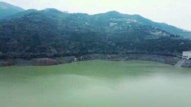 Drought in Turkey. Drought crisis in Turkey. Aerial view of dam with low water level. Yuvacik dam or Kirazdere dam in Kocaeli Turkey. Drone view. Selective focus included. Noisy photo.