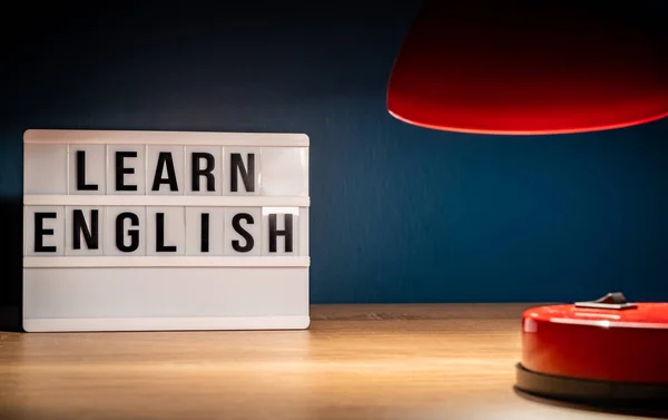 Learning English concept. Learn English on white letter board. Language learning concept background