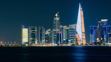 Katar 'da gece vakti Doha Skyline. Doha Şehir Manzarası. İş konsepti