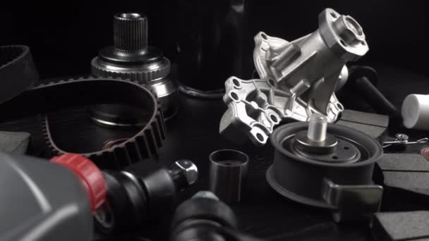 Lot Auto Parts Lie Wooden Black Background Engine Suspension Parts — Stock Video