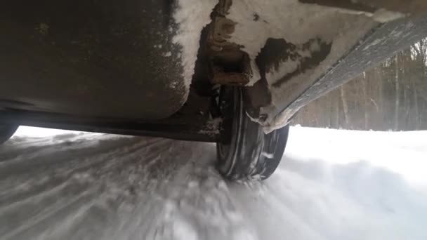 View Bottom Car Suspension Wheels Car Accelerates Winter Highway Bottom — Stockvideo