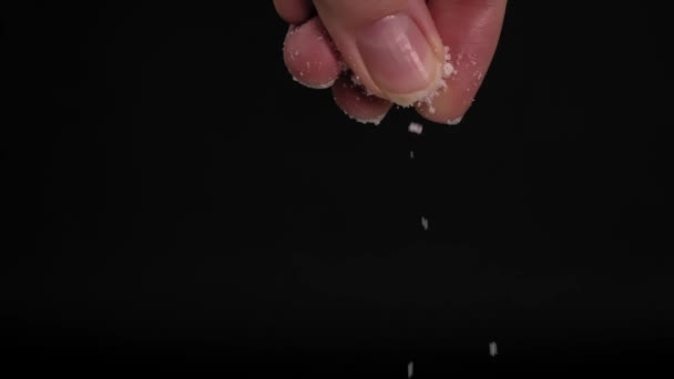 Slow Motion Video Large Female Hand Sprinkling Adding Salt Black — Video