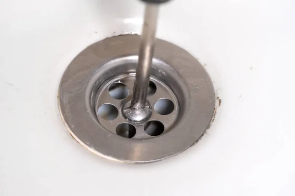 Close Screwdriver Unscrewing Drain White Sink Jack All Trades Repairing — Stock Photo, Image
