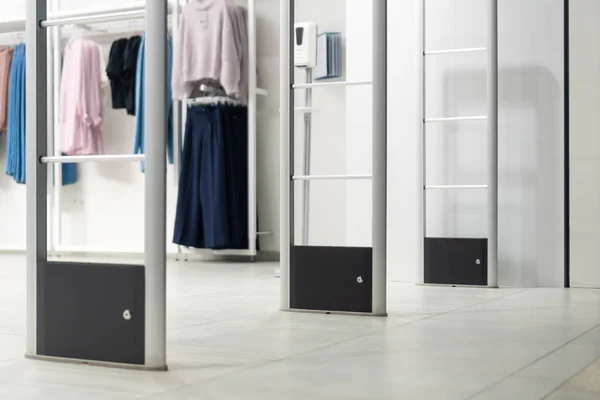 Anti-theft system in a clothing store. Entrance gate with scanner to prevent theft