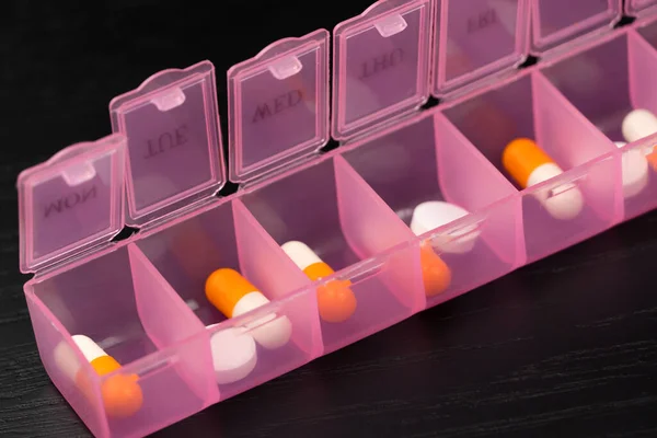 Close Filled Pink Pillbox Organizer Pills Vitamins Food Additives Black — Stock Photo, Image