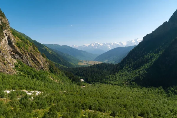 Beautiful mountain landscape on the valley near the waterfall Shdugra, Mazeri, Svaneti, Georgia on a sunny bright summer day