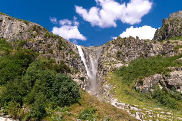 stock image Majestic beautiful bright summer view of the mountain peaks and the Shdugra waterfall, Mazeri in the mountains of Upper Svaneti, Georgia. Conceptual background of the beauty of nature.