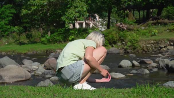 Young Beautiful Blndina Touching Water Mountain River Woman Wets Washes — Stock Video