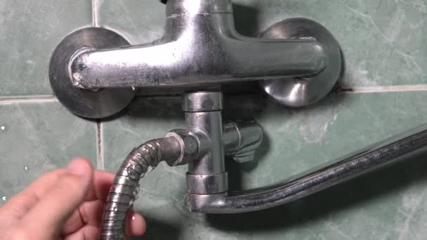 Close Man Hand Holding Damaged Old Rusty Leaking Water Faucet — Stock Video