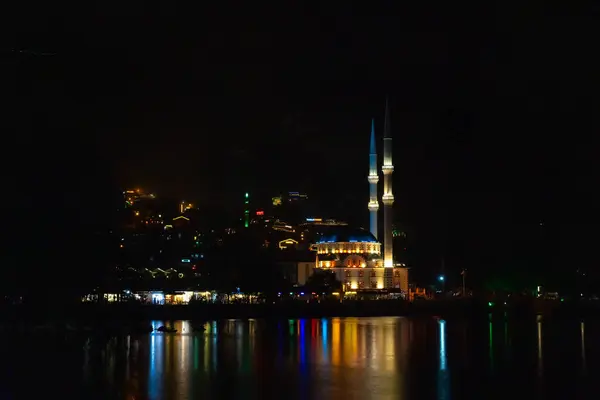 stock image Illuminated mosque on Uzungol Lake at night, Turkey. Concept of travel, religion