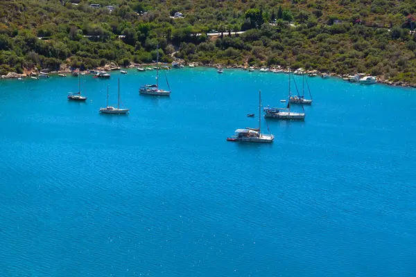 stock image Beautiful incredible landscape with the sea, yachts, boats against the background of the Turkish Mediterranean coast on a sunny day, Kas.