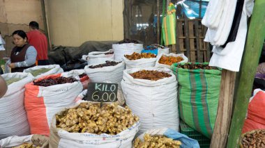 Chimbote, Peru - April 18, 2024: Various chillies, turmeric and ginger for sale in public market Mercado dos de Mayo (2nd May Market) clipart