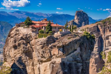 The Holy Trinity Monastery (Agia Triada) at Meteora is one of the most photographed monuments in Kalambaka in Greece clipart