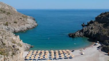 Aerial panoramic view of the famous rocky beach Chalkos in Kythira island at sunset. Amazing scenery with crystal clear water and a small rocky gulf in Mediterranean sea, Greece, Europe.