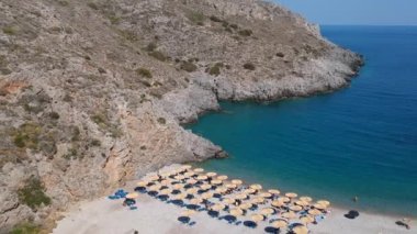 Aerial panoramic view of the famous rocky beach Chalkos in Kythira island at sunset. Amazing scenery with crystal clear water and a small rocky gulf in Mediterranean sea, Greece, Europe.