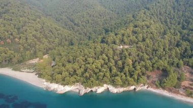 Aerial panoramic view over Milia beach in Skopelos island, against a cloudy sky in Sporades, Greece