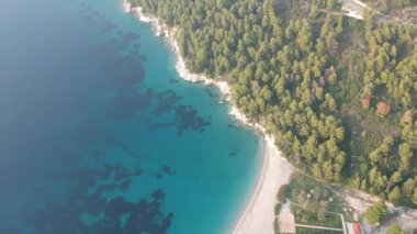 Aerial panoramic view over Milia beach in Skopelos island, against a cloudy sky in Sporades, Greece