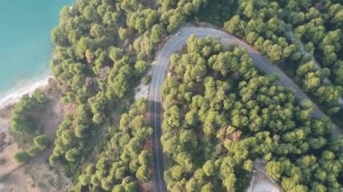 Aerial panoramic view over Milia beach in Skopelos island, against a cloudy sky in Sporades, Greece