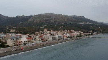 Aerial cityscape view of Neapolis town at sunset. Also named Vatika in Laconia, Greece. Neapoli is a famous coastal town built on the same site as the ancient Laconian city of Boeae