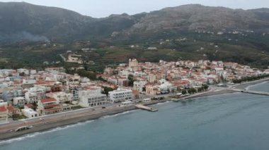 Aerial cityscape view of Neapolis town at sunset. Also named Vatika in Laconia, Greece. Neapoli is a famous coastal town built on the same site as the ancient Laconian city of Boeae