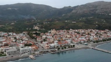 Aerial cityscape view of Neapolis town at sunset. Also named Vatika in Laconia, Greece. Neapoli is a famous coastal town built on the same site as the ancient Laconian city of Boeae