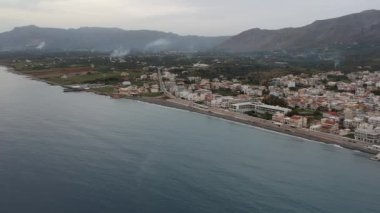 Aerial cityscape view of Neapolis town at sunset. Also named Vatika in Laconia, Greece. Neapoli is a famous coastal town built on the same site as the ancient Laconian city of Boeae
