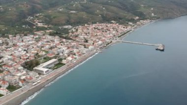 Aerial cityscape view of Neapolis town at sunset. Also named Vatika in Laconia, Greece. Neapoli is a famous coastal town built on the same site as the ancient Laconian city of Boeae