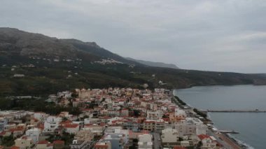 Aerial cityscape view of Neapolis town at sunset. Also named Vatika in Laconia, Greece. Neapoli is a famous coastal town built on the same site as the ancient Laconian city of Boeae