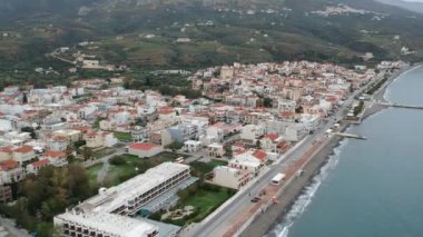 Aerial cityscape view of Neapolis town at sunset. Also named Vatika in Laconia, Greece. Neapoli is a famous coastal town built on the same site as the ancient Laconian city of Boeae
