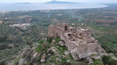 Aerial view of the Castle of Vatika or Castle of Agia Paraskevi at sunset. The castle is located in Mesohori village and has a wonderful view of Neapolis town and Elafonissos island, Laconia, Greece.